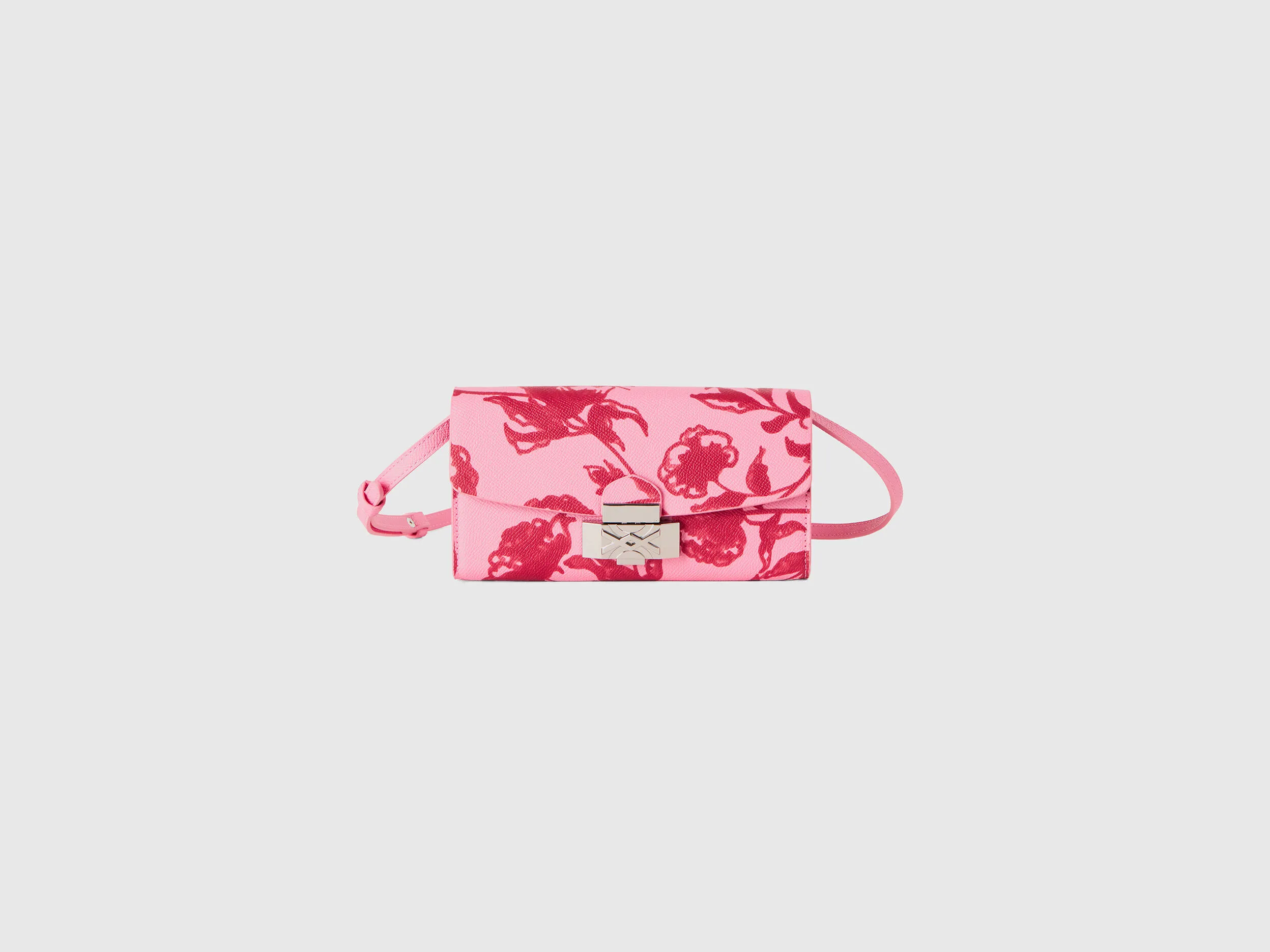 Bolso portamóvil rosa pastel con estampado floral