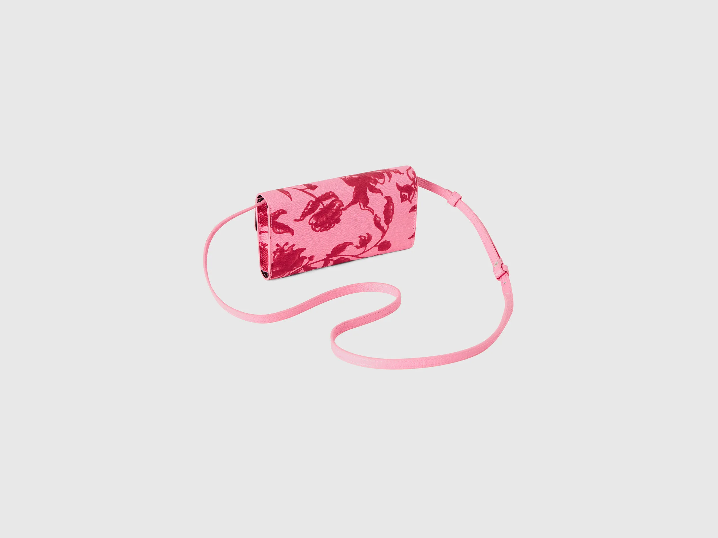 Bolso portamóvil rosa pastel con estampado floral