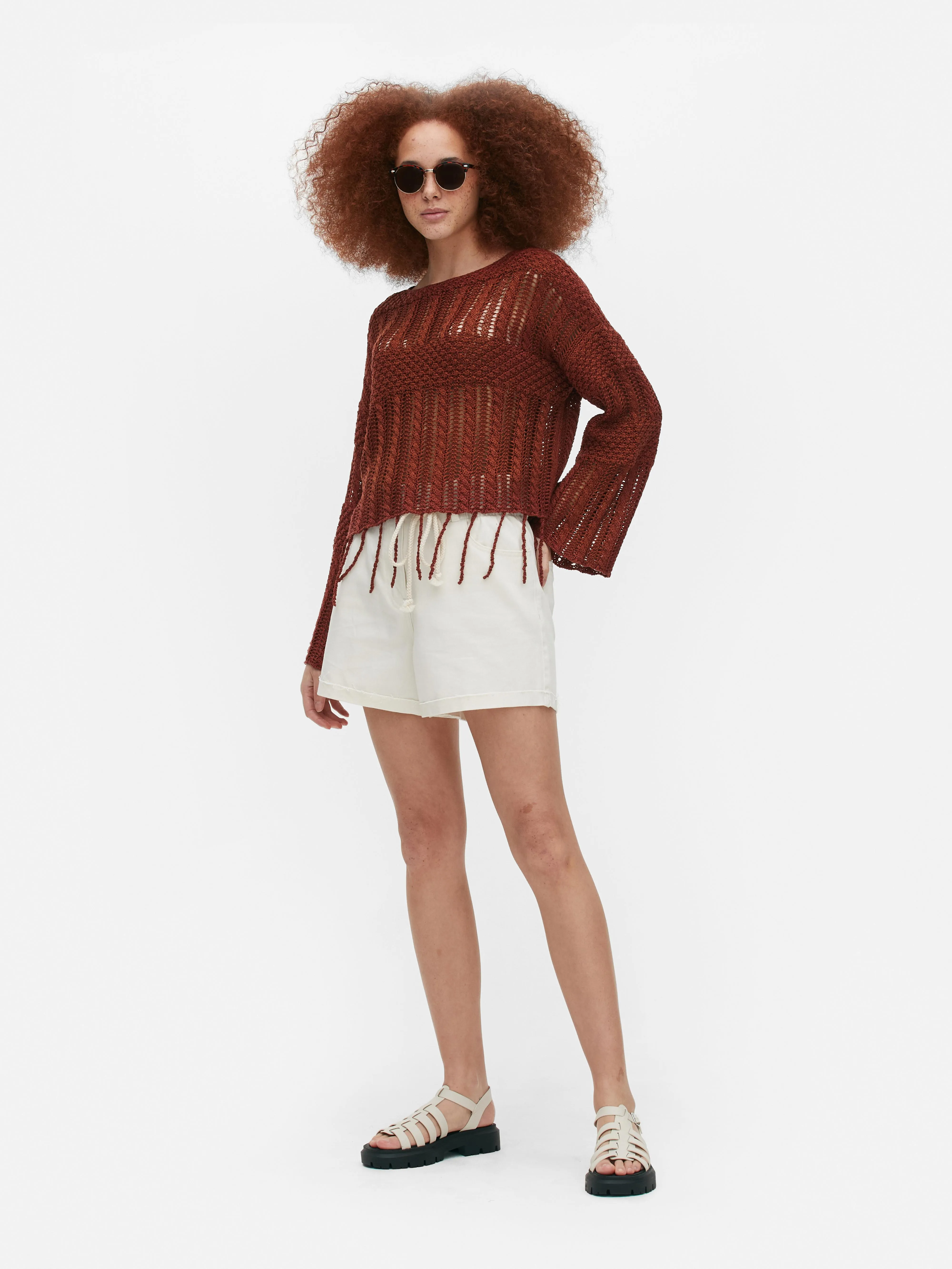 Jersey de crochet con borlas