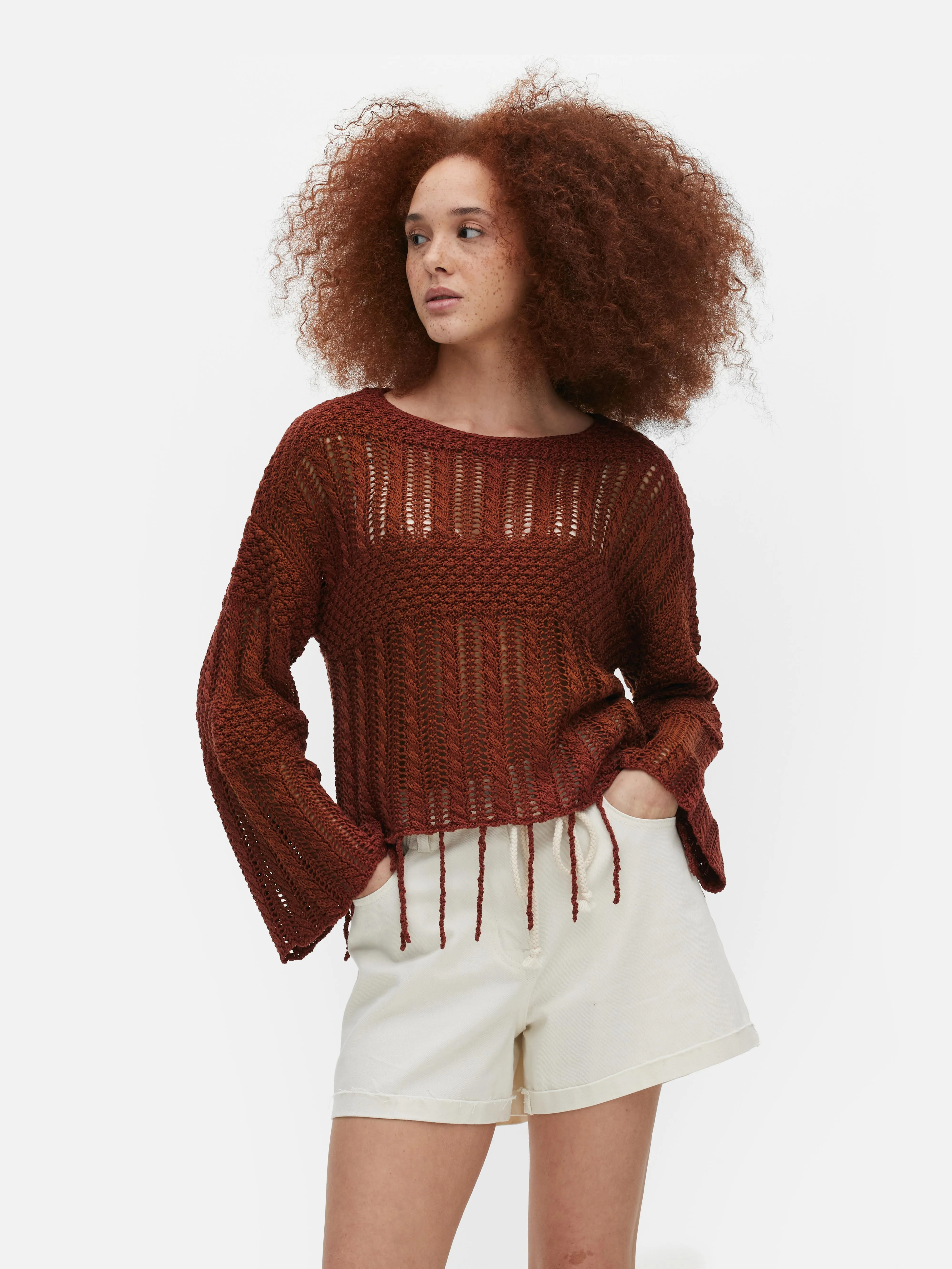 Jersey de crochet con borlas