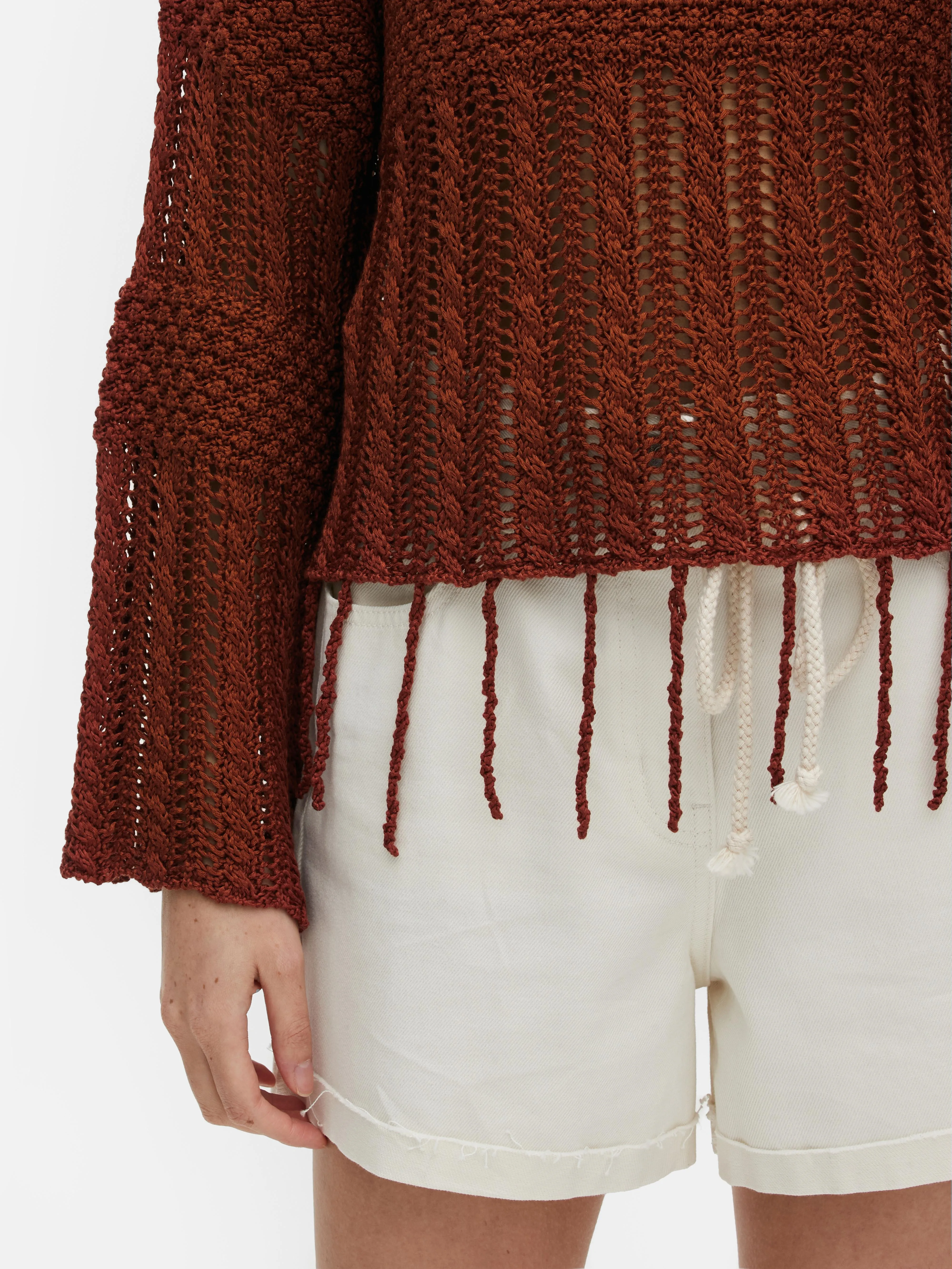 Jersey de crochet con borlas