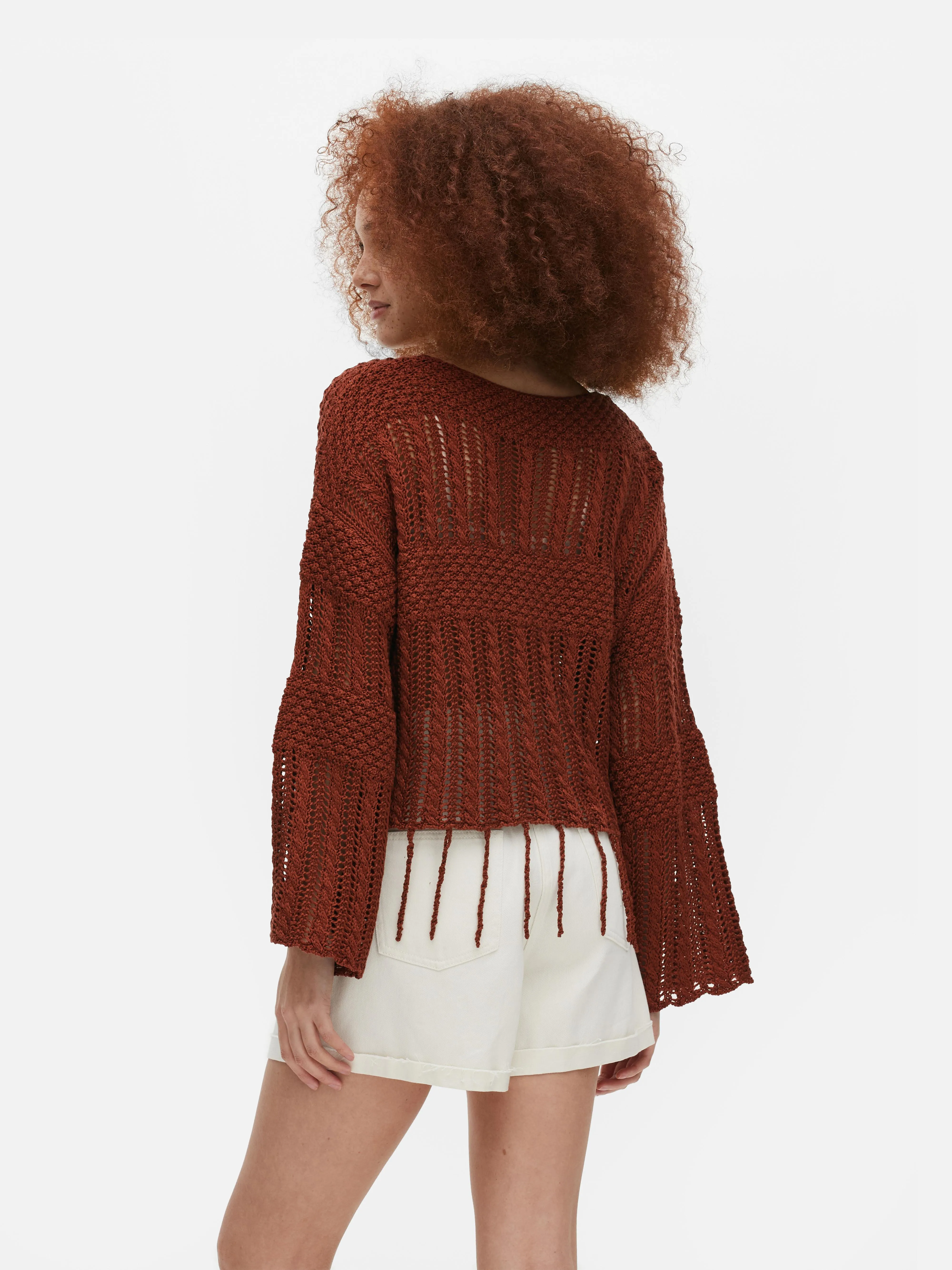 Jersey de crochet con borlas