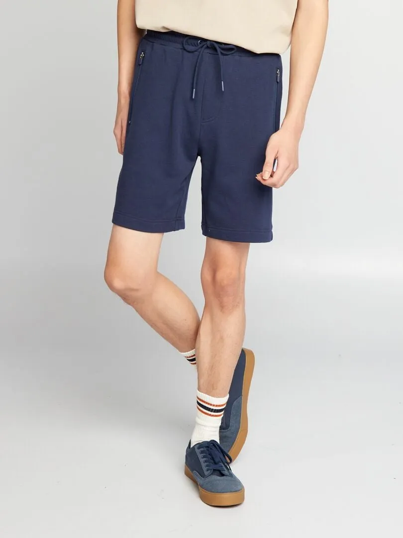 PANTALóN CORTO DE CHáNDAL CON BOLSILLOS CON CREMALLERA  NEGRO