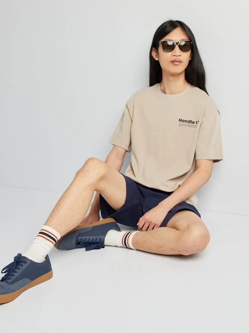 PANTALóN CORTO DE CHáNDAL CON BOLSILLOS CON CREMALLERA  NEGRO