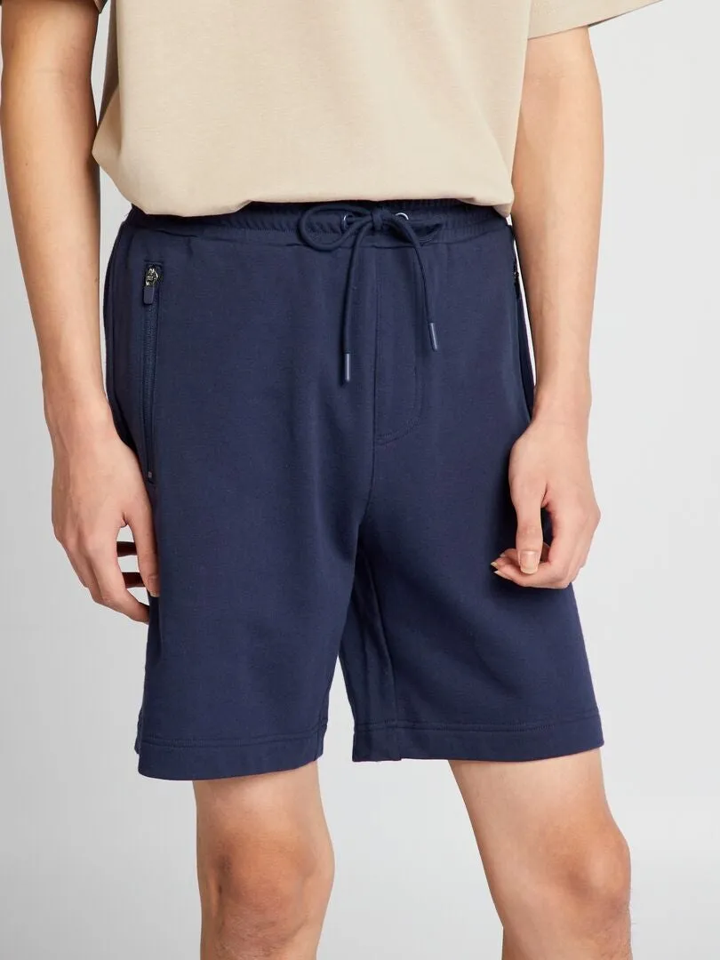 PANTALóN CORTO DE CHáNDAL CON BOLSILLOS CON CREMALLERA  NEGRO