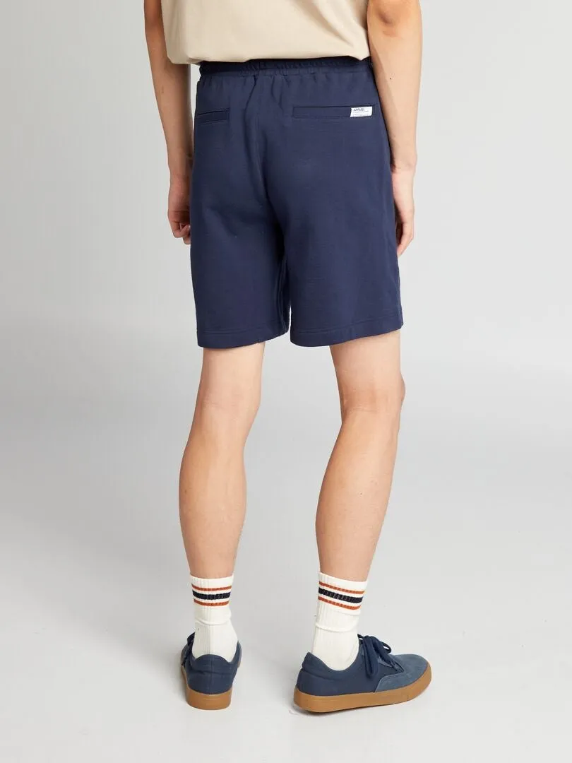 PANTALóN CORTO DE CHáNDAL CON BOLSILLOS CON CREMALLERA  NEGRO